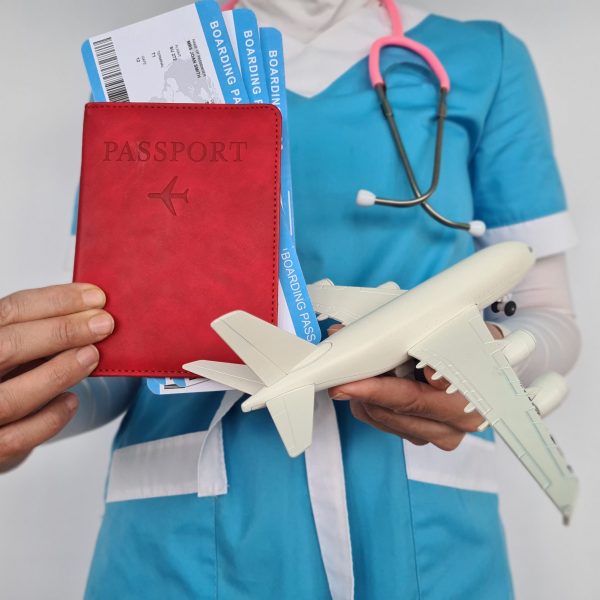 Medical tourism medical travel concept. Stethoscope, toy airplane and passport